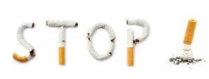 broken cigarettes spell out the word stop