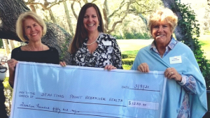 Laureen Pagel, CEO at Starting Point Behavioral Healthcare, accepting award from the Plantation Ladies Association of Amelia Island Community Outreach Chair, Peg Kolasa, and President, Lynne Pelletiere
