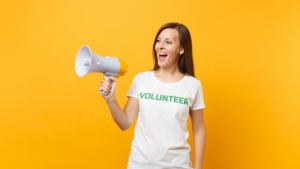 Volunteer woman holding up a megaphone
